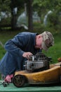 Repairing lawn mower engine Royalty Free Stock Photo