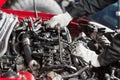 Repairing of modern diesel engine, workers hands and tool. Close-up of an auto mechanic working on a car motor