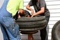 Repairing a tractor tire with an inner tube Royalty Free Stock Photo