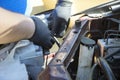 Repairman assembling vehicle headlight during a repair