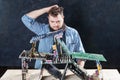 Repairman builds house of cards from motherboards Royalty Free Stock Photo