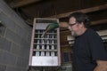 Repairman Cleaning The Grates Of A Gas Furnace