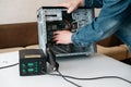 Repairman is disassembling personal computer. Royalty Free Stock Photo