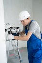 Repairman Doing House Renovation by Using Puncher