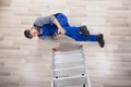 Repairman Fallen From Ladder Royalty Free Stock Photo