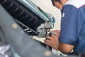 Repairman fixing and cleaning air conditioning system, Air Conditioning Repair, Male technician service for repair and maintenance Royalty Free Stock Photo