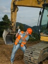 Repairman fixing excavator track