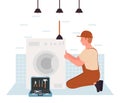 Repairman fixing washing machine Royalty Free Stock Photo