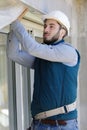 repairman fixing window with screwdriver Royalty Free Stock Photo