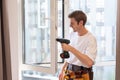 A repairman fixing windows in new apartment Royalty Free Stock Photo