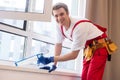 A repairman fixing windows in new apartment Royalty Free Stock Photo