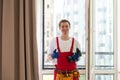 A repairman fixing windows in new apartment. Royalty Free Stock Photo
