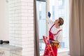 A repairman fixing windows in new apartment. Royalty Free Stock Photo