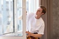 A repairman fixing windows in new apartment. Royalty Free Stock Photo