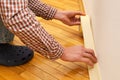 Apply painter`s tape to baseboard