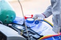 Repairman holds monitor tool to check and fix car air conditioner system, Technician checks car air conditioning system