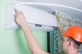 Repairman install air conditioning Royalty Free Stock Photo