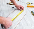 Repairman laying laminate flooring at home Royalty Free Stock Photo