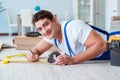 The repairman laying laminate flooring at home Royalty Free Stock Photo