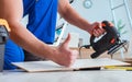 Repairman laying laminate flooring at home Royalty Free Stock Photo