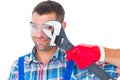 Repairman looking through adjustable wrench Royalty Free Stock Photo