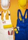 Repairman and painter work uniforms with tools Royalty Free Stock Photo