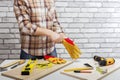 Repairman  putting of protective gloves. Royalty Free Stock Photo