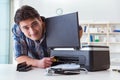 The repairman repairing broken color printer Royalty Free Stock Photo