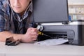 The repairman repairing broken color printer