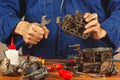Repairman repairing parts of old automobile engine in workshop Royalty Free Stock Photo
