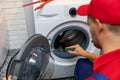 Repairman repairing washing machine door Royalty Free Stock Photo