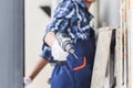 Repairman with screwdriver standing on ladder fixing air conditioner unit, Technician installing air conditioning, Maintenance and Royalty Free Stock Photo