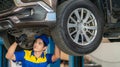 repairman and technician in car garage service in blue uniform