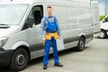 Repairman With Tools And Toolbox In Front Of Van Royalty Free Stock Photo