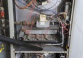 Repairman Vacuuming Inside Of A Gas Furnace Royalty Free Stock Photo