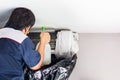 Repairman washing dirty compartments air conditioner, Male technician cleaning air conditioner indoors, Maintenance and repairing Royalty Free Stock Photo