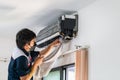 Repairman washing dirty compartments air conditioner, Male technician cleaning air conditioner indoors, Maintenance and repairing Royalty Free Stock Photo