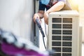 Repairman washing dirty compartments air conditioner, Male technician cleaning air conditioner indoors, Maintenance and repairing Royalty Free Stock Photo