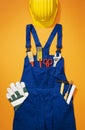 Repairman work uniform with tools and hardhat