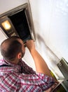 Repairman work on ventilation in the kitchen Royalty Free Stock Photo