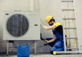 Repairman working on air conditioner Royalty Free Stock Photo