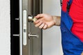 Repairman working with door lock Royalty Free Stock Photo