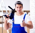 Repairman working with drilling drill perforator Royalty Free Stock Photo