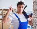 Repairman working with drilling drill perforator Royalty Free Stock Photo