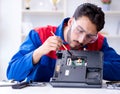 Repairman working in technical support fixing computer laptop tr Royalty Free Stock Photo