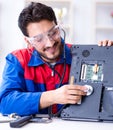 Repairman working in technical support fixing computer laptop tr Royalty Free Stock Photo