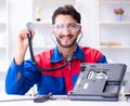 Repairman working in technical support fixing computer laptop tr Royalty Free Stock Photo