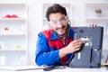 Repairman working in technical support fixing computer laptop tr Royalty Free Stock Photo