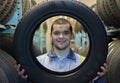 Repairmen automobile mechanic with car tire Royalty Free Stock Photo