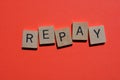 Repay, word isolated on red background